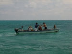 Taking smaller boat to tour Northern Caye