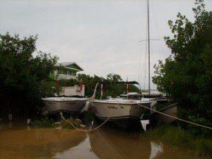 Three boats and a Catamaran Boat in Belize Ambergris Caye