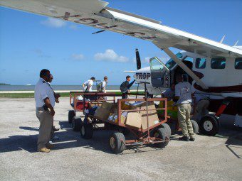 Tropic Air Pilot and Cargo boys Tropic Air Belize Cessna Caravan