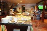 Cindy serving up Indian Food ambergris caye bars