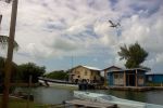Ttopic Air plane flying over canal Tropic Air Belize