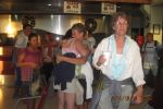 Sue welcoming Christy to Belize with a big hug tropic air belize