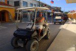 Zac waiting on cart outside Tropic tropic air belize