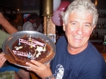 Pedro holding his fabulous chocolate Wanker cake - ordered by Cindy with Ana\'s help at the pool this morning