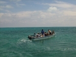 Taking smaller boat to tour Northern Caye